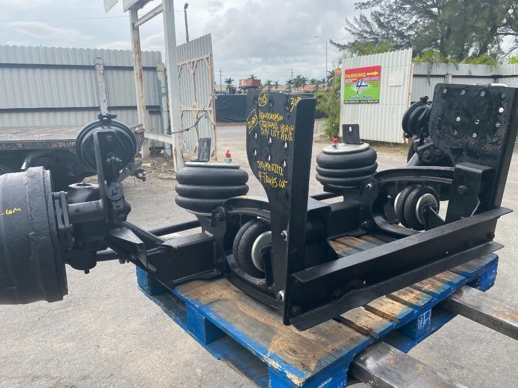 Refurbished HENDRICKSON STEERABLE LIFT AXLE Tag Axles in Miami, FL
